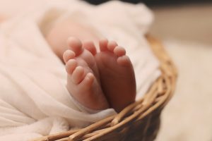 women of the bible baby feet in a basket