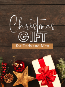 Dark wooden background, Christmas gifts wrapped along the bottom, words "Christmas Gifts for Dads and Men" in the center in 3 different fonts.